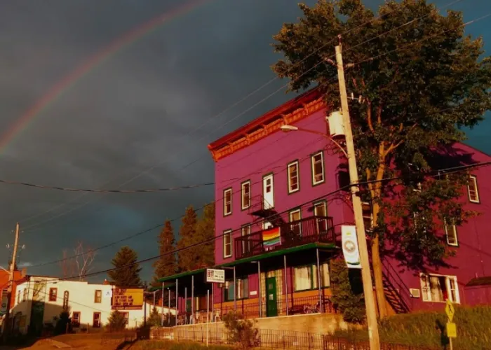 Rainbow on a cloudy day over The Arlington Hostel in Maynooth, Ontario outside Algonquin Park