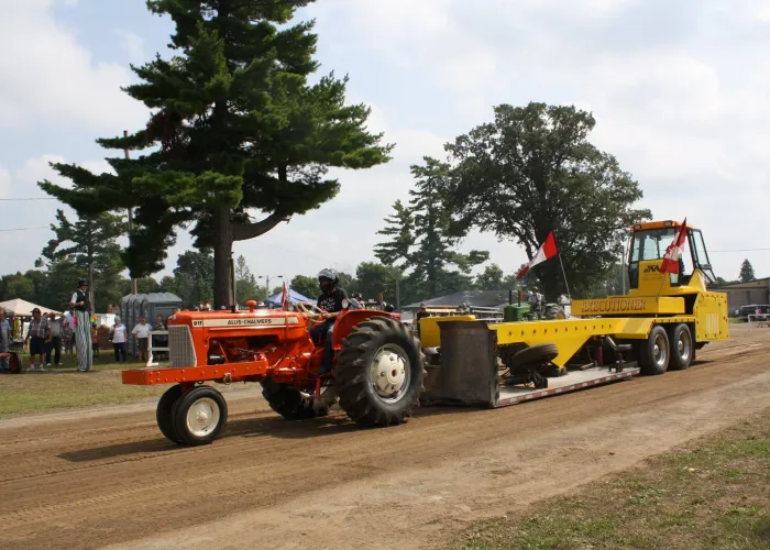 Tractor pulling a large weighted trailer at the Marmora Fair